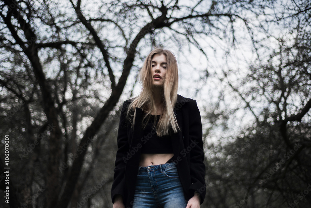 portrait of a beautiful girl in a black coat on the nature portrait of a beautiful girl in a black coat on the nature