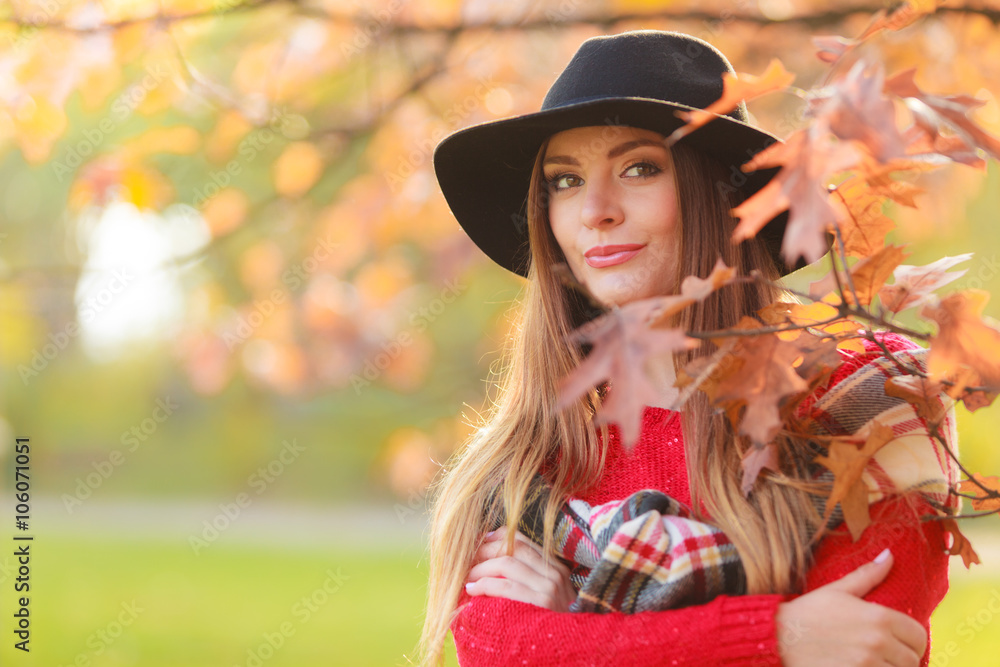 Beautiful woman in autumn park