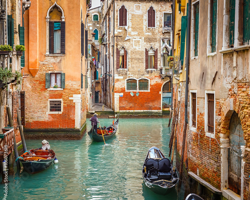Gondolas on narrow canal in Venice, Italy © sborisov