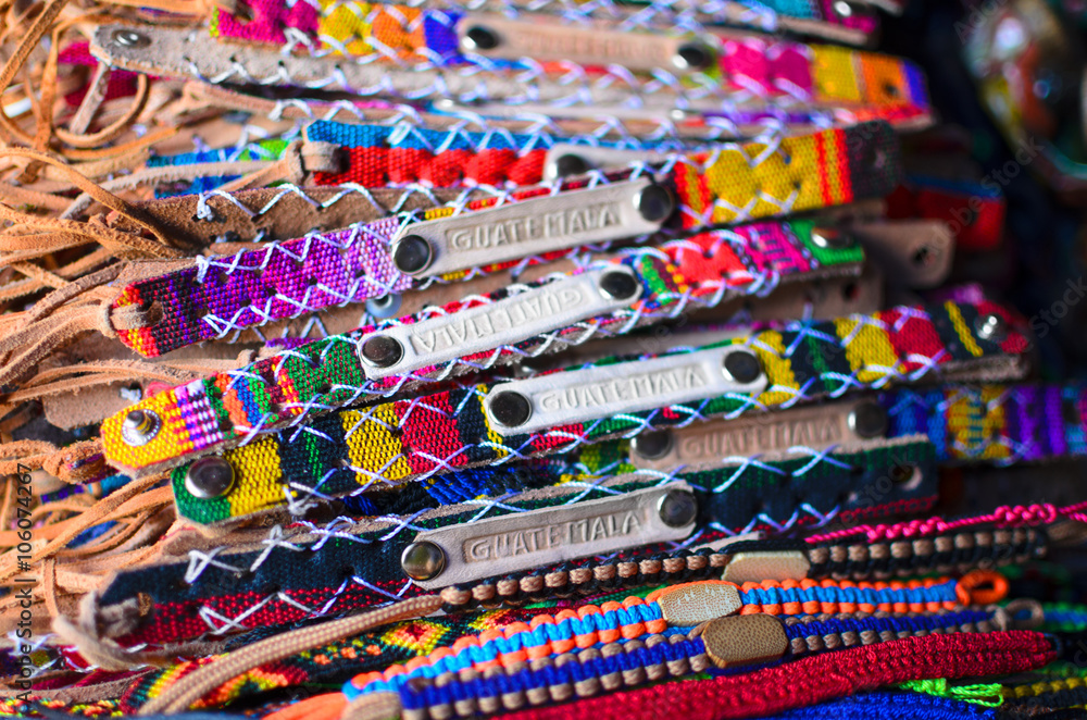 Numerous wristbands with Guatemala sing at the craft market 