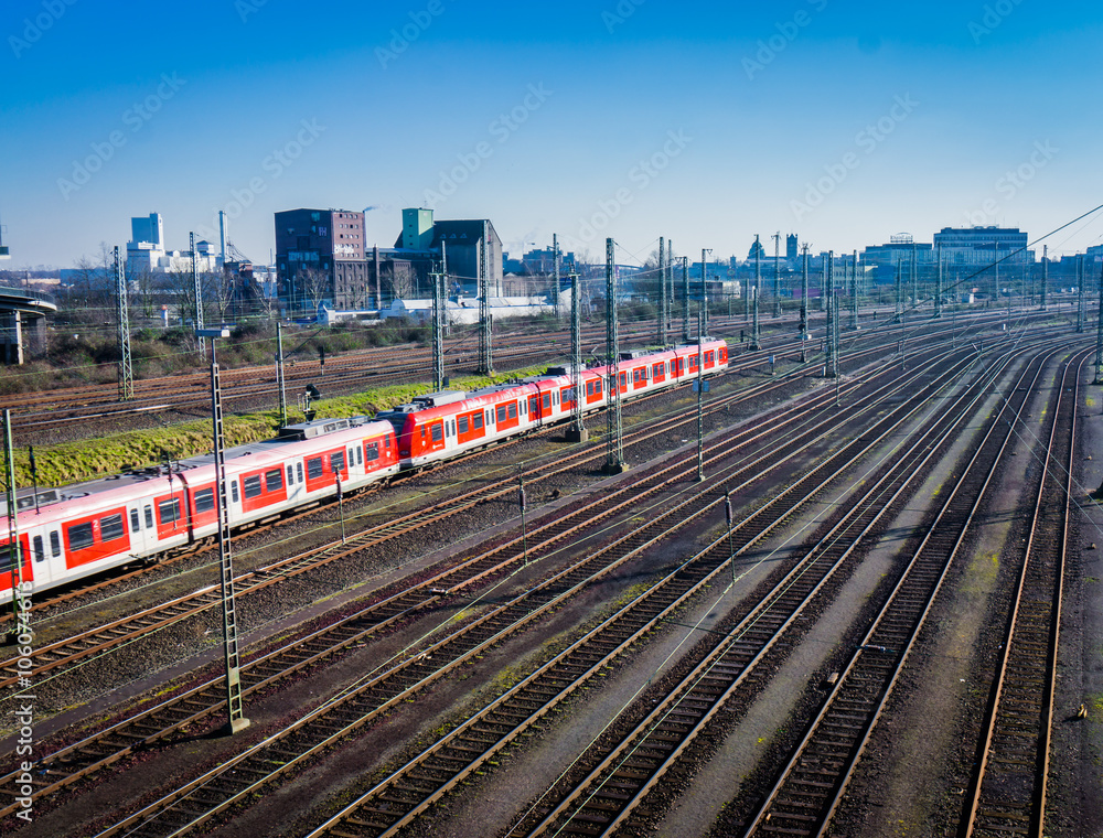 Obraz premium passenger train. Red train on tracks