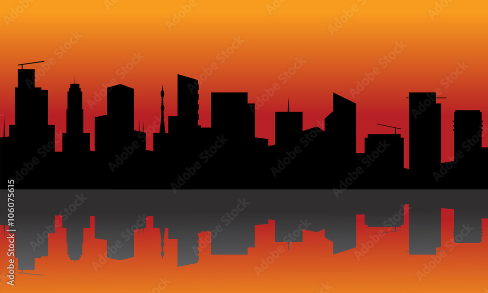 Silhouette of city with orange background