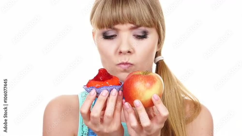 Woman choosing fruit or cake make dietary choice 4K Woman choosing fruit or cake make dietary choice 4K