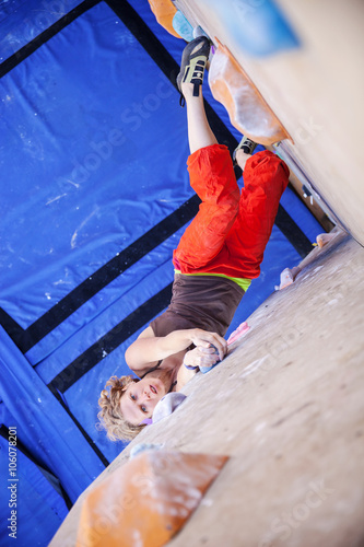 Female climber on artificial climbing wall