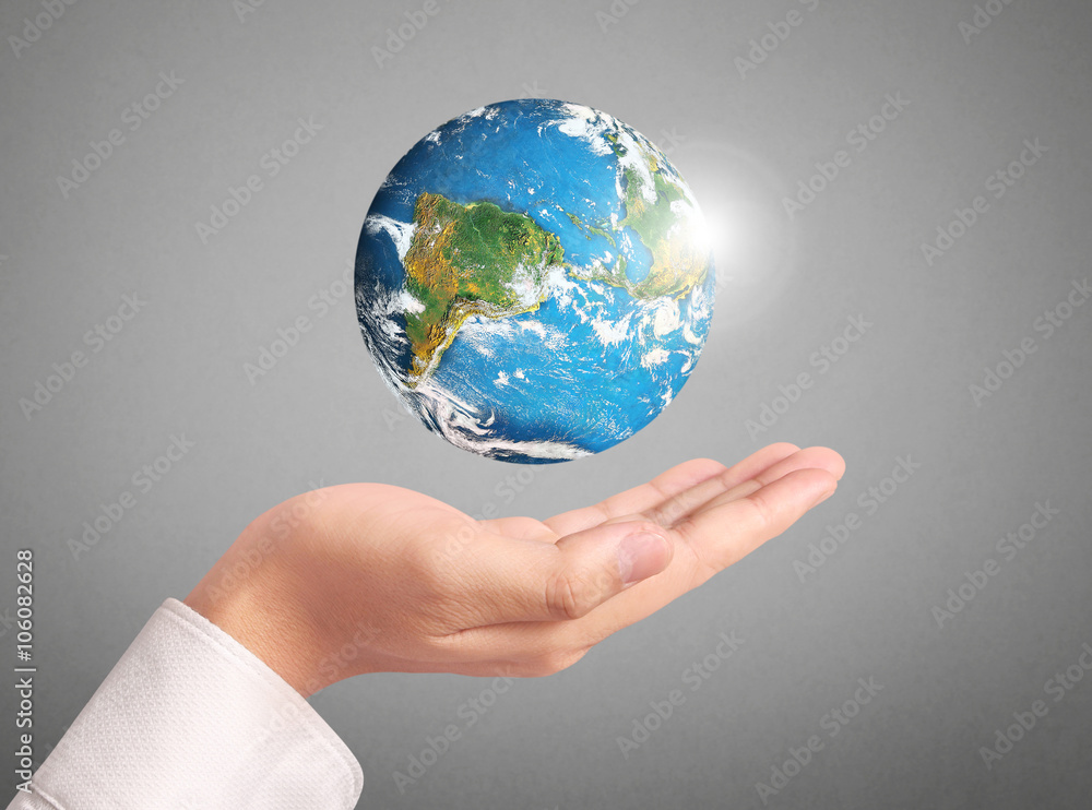 hand holding globe Elements of this image furnished by NASA hand holding globe Elements of this image furnished by NASA