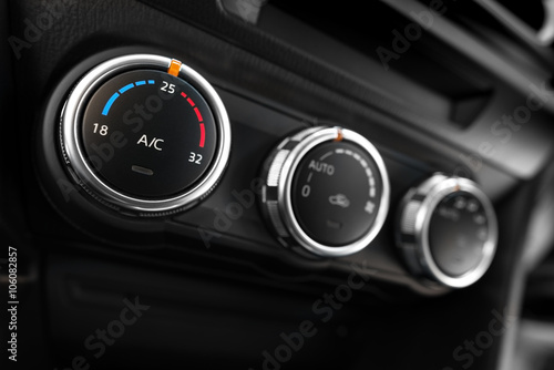 detail of the air conditioning button inside a car