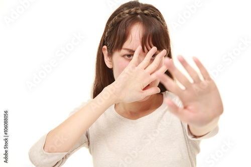 young woman making stop gesture