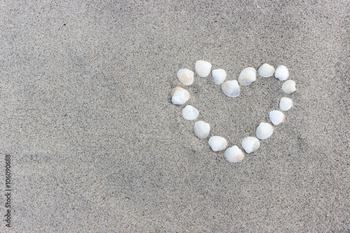 heart / Heart made of shells on the sandy beach