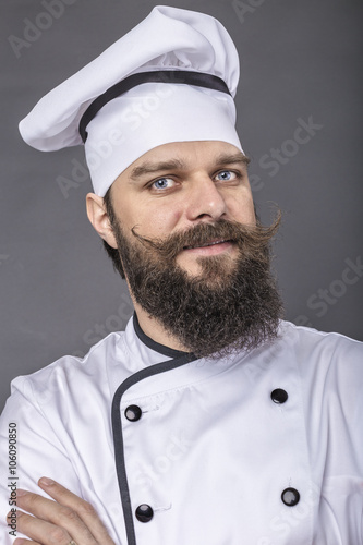 Obraz na płótnie Portrait of a bearded young chef with arms folded w salonie
