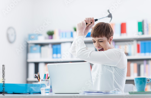 Woman destroying her laptop