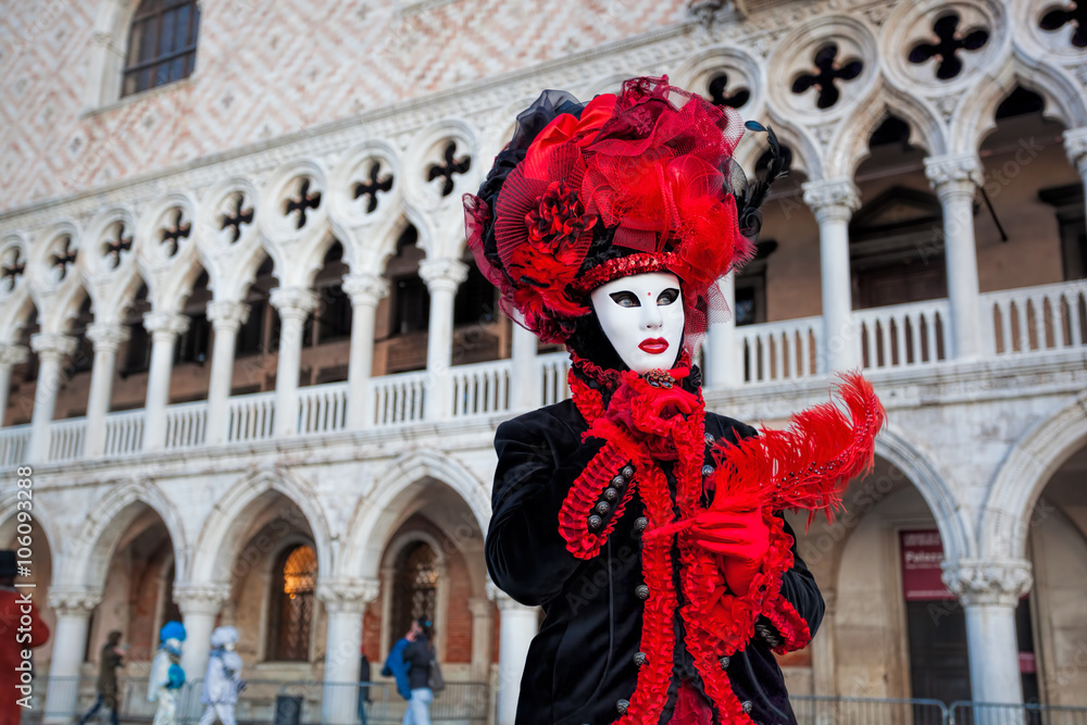 Fototapeta premium Carnival mask against Doge palace in Venice, Italy