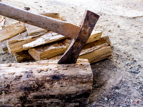 Cut logs firewood and old axe