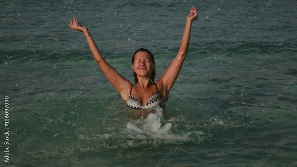 slow motion video of a Woman Playing With Sea Water At Beautiful Sunset
slow motion video of a Woman Playing With Sea Water At Beautiful Sunset