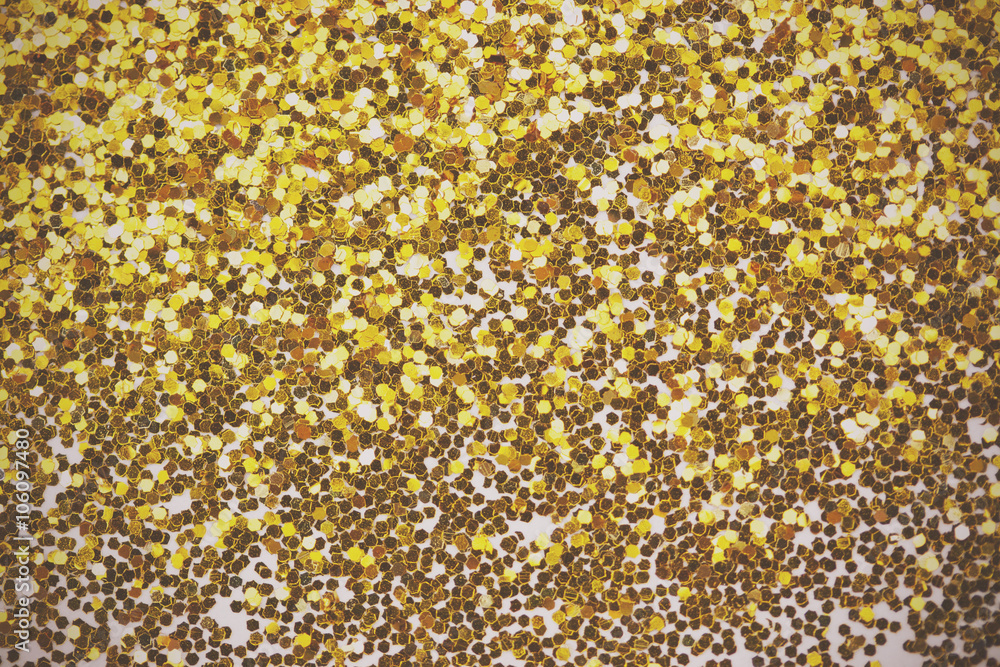 Close up a fine shining gold glitter Close up a fine shining gold glitter