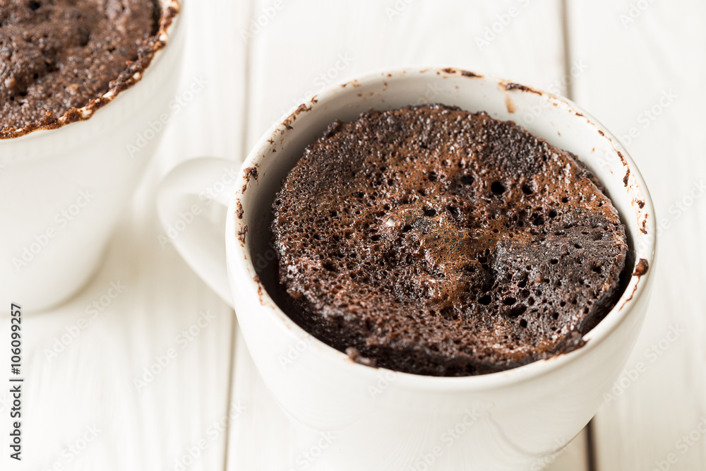 Chocolate Mug Cakes, Cupcakes on Light White Background Chocolate Mug Cakes, Cupcakes on Light White Background