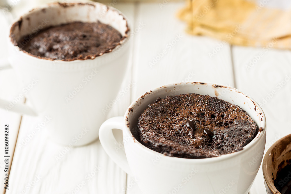 Chocolate Mug Cakes, Cupcakes on Light White Background Chocolate Mug Cakes, Cupcakes on Light White Background