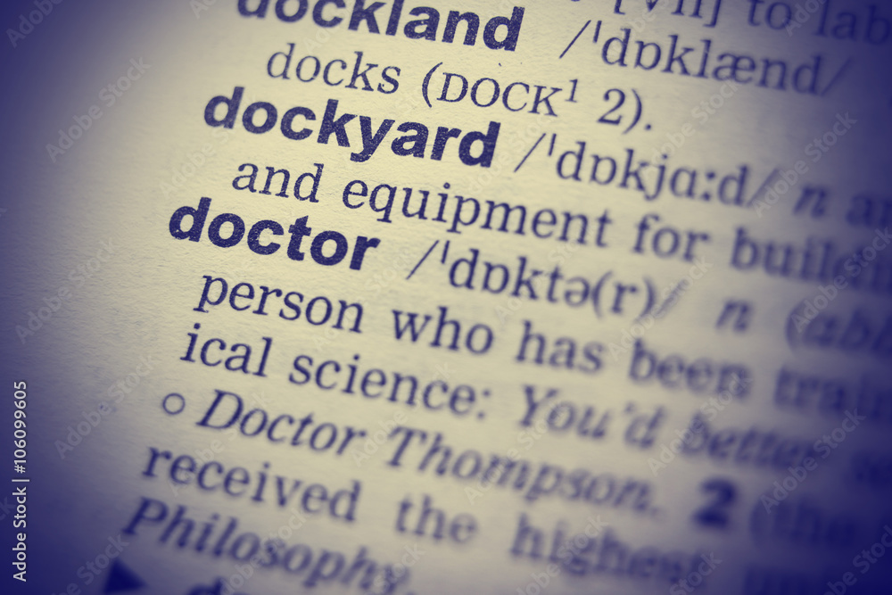 Obraz premium Close-up of word in English dictionary. Doctor definition and transcription.