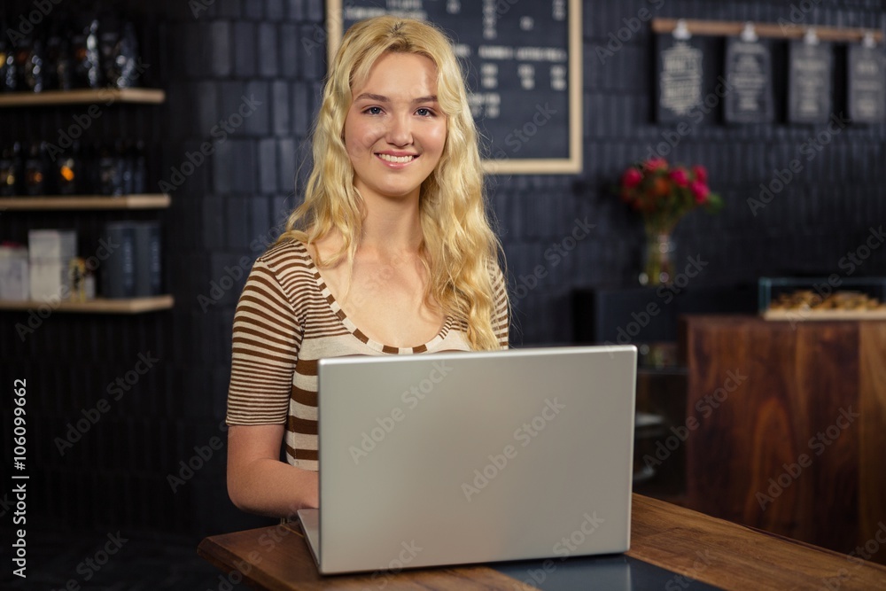 Smiling woman using laptop Smiling woman using laptop