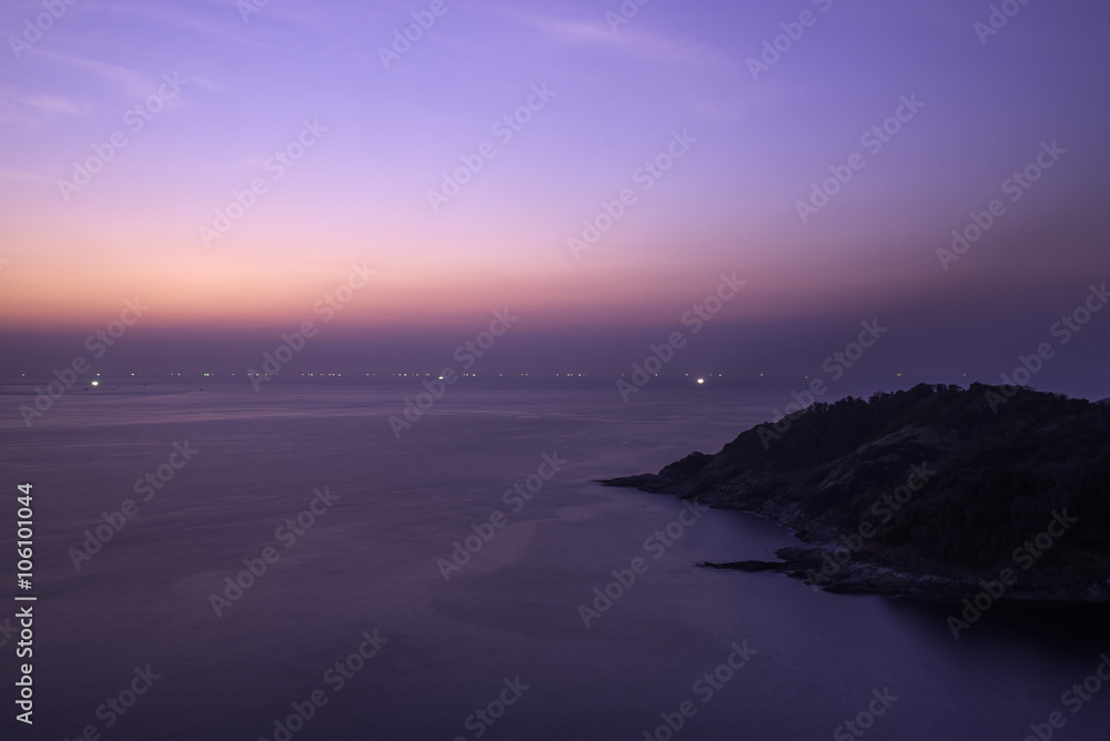 Fototapeta premium A woman feeling success when see sunset on mountain.