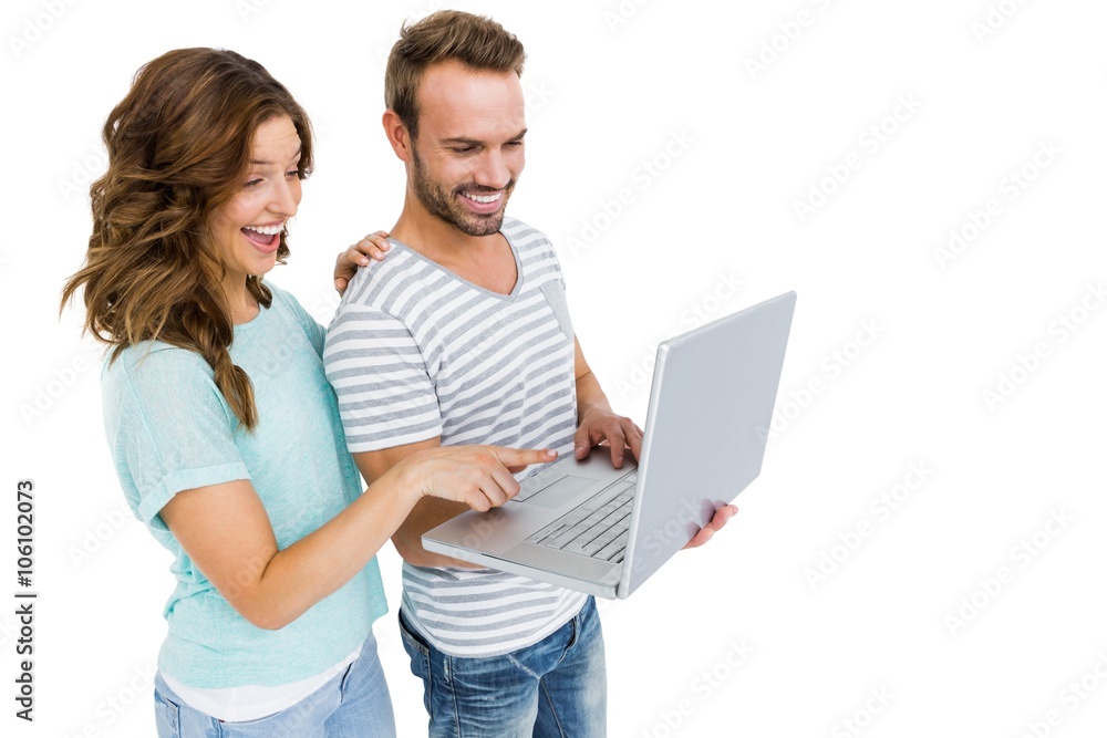Happy young couple using laptop Happy young couple using laptop