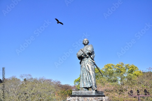 The eagle and statue of Sakamoto Ryoma in Kazagashira Park on April 6, 2014 at Nagasaki, Japan. Sakamoto Ryoma is a prominent figure in Japan.
