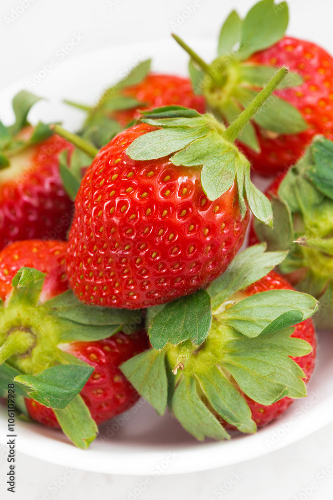 fresh strawberries in a bowl, closeup vertical fresh strawberries in a bowl, closeup vertical