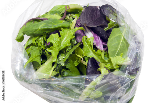 Open plastic bag with fresh spring salad