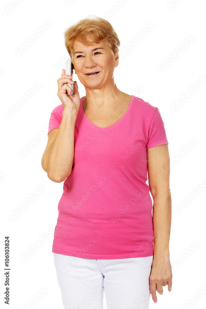 Smiling senior woman talking through phone Smiling senior woman talking through phone