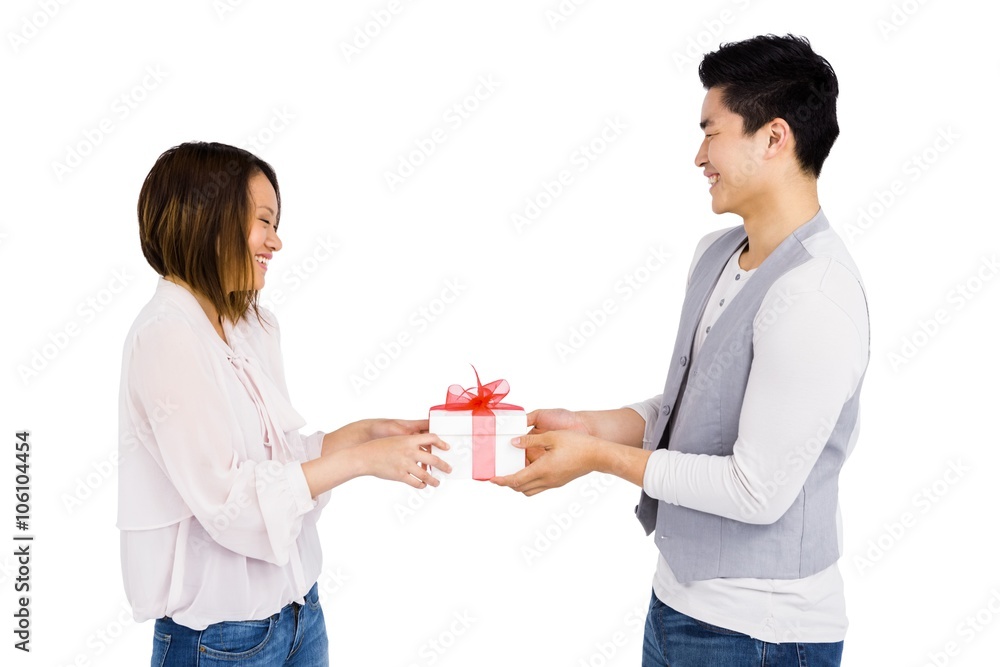 Young man giving a present to woman Young man giving a present to woman