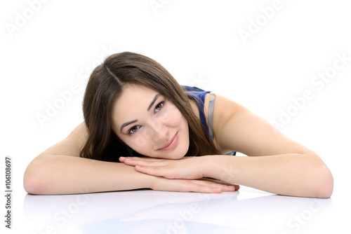 Portrait of attractive teen girl looking at camera over white