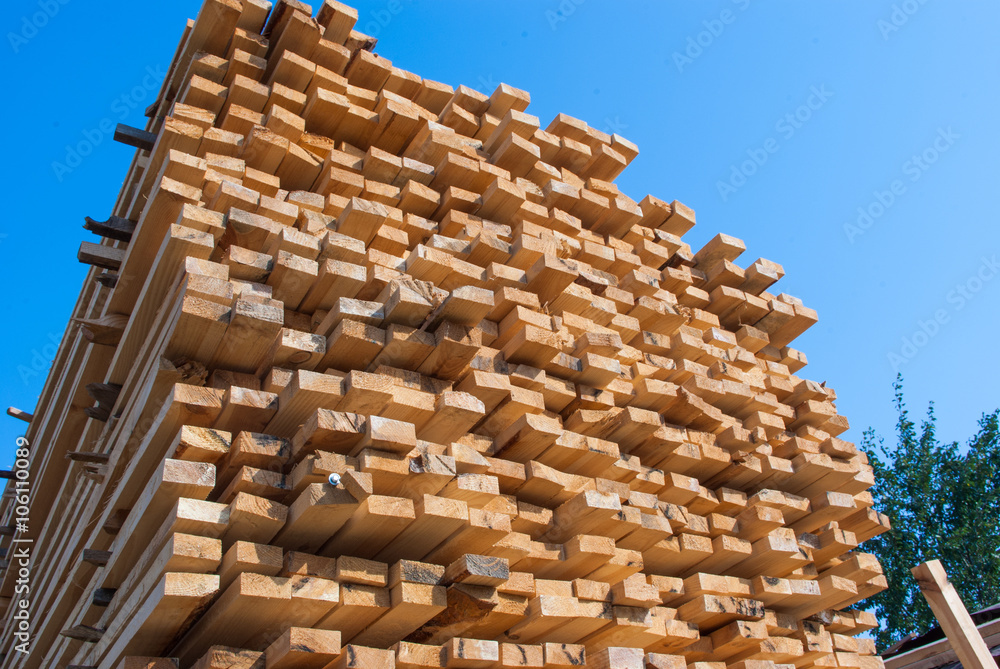 Fresh wooden boards stacked to the warehouse Fresh wooden boards stacked to the warehouse