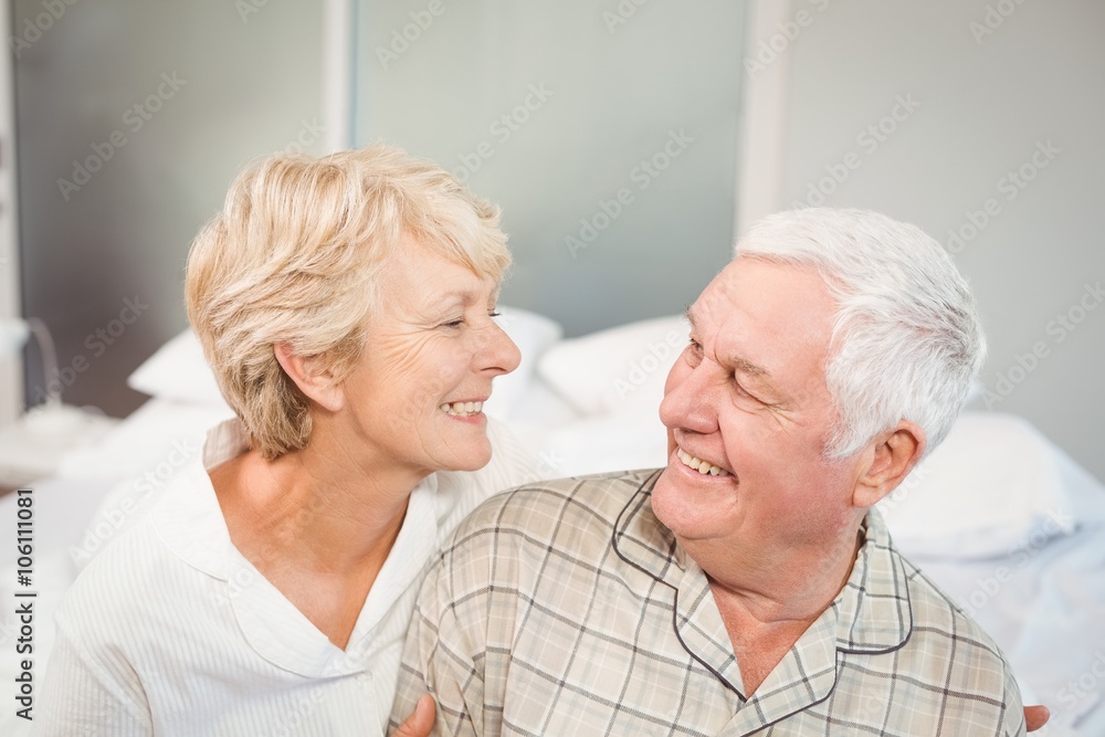 High angle view of happy senior couple in nightwear High angle view of happy senior couple in nightwear