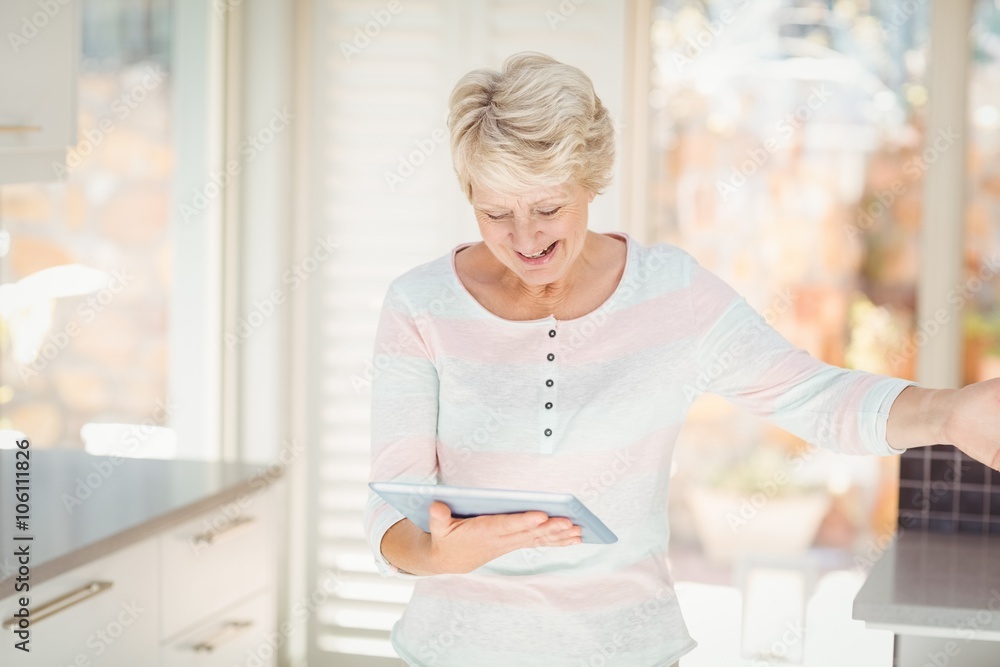Happy senior woman using digital tablet Happy senior woman using digital tablet