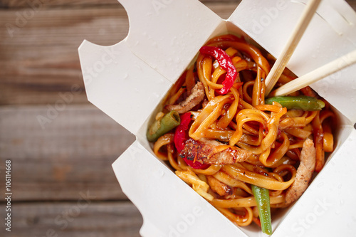 Asian noodles with fresh green onion and boiled egg photo