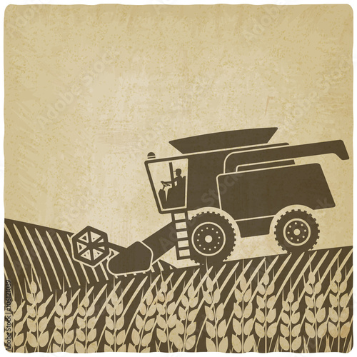 combine harvester in field old background