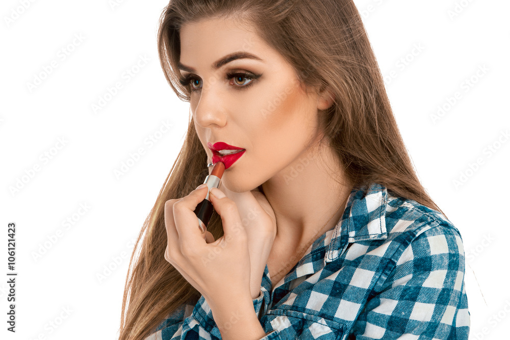 Young beauty woman makes makeup with lipstick Young beauty woman makes makeup with lipstick