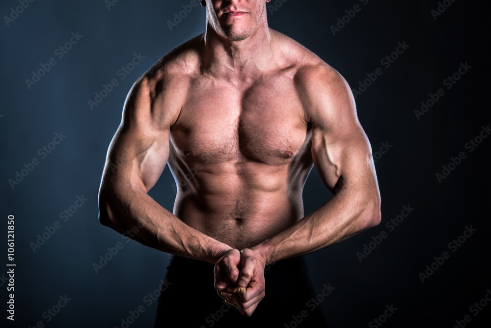 detail of powerful muscular body of bodybuilder in pose detail of powerful muscular body of bodybuilder in pose
