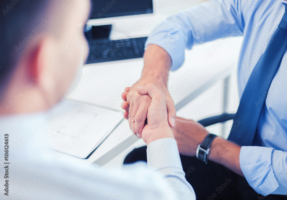 businessmen shaking hands in office businessmen shaking hands in office