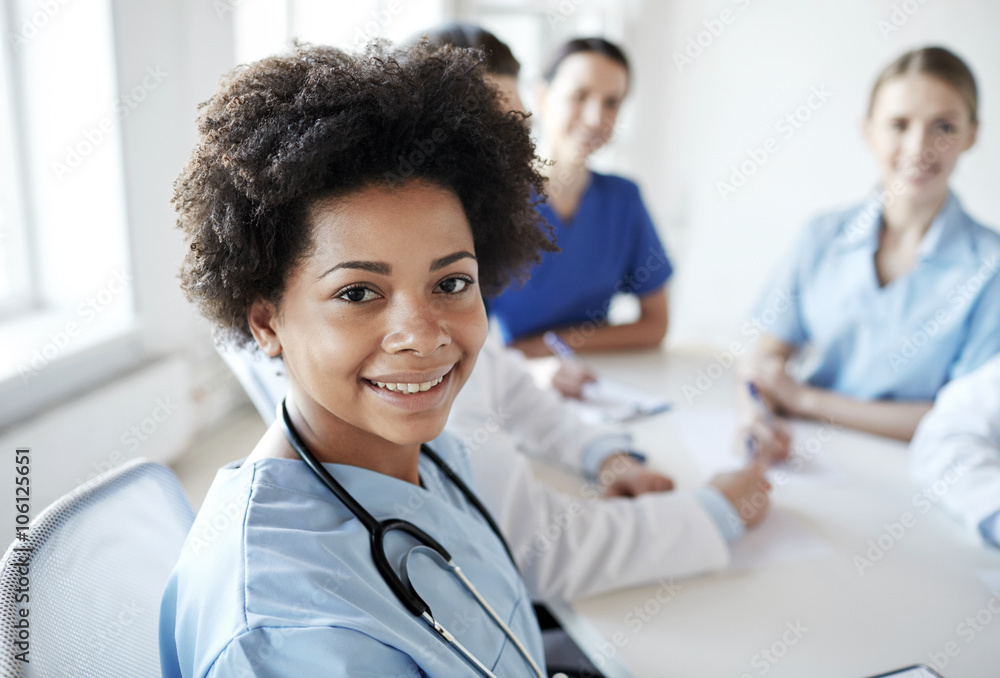 happy doctor over group of medics at hospital happy doctor over group of medics at hospital