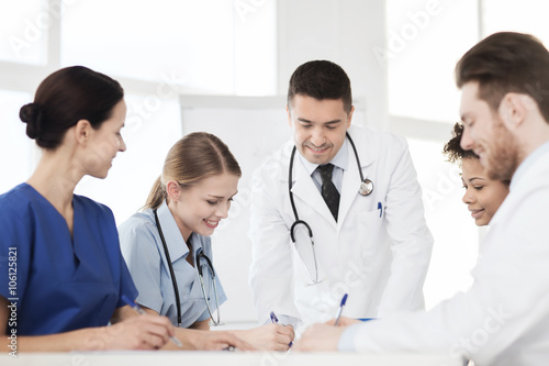 group of happy doctors meeting at hospital office