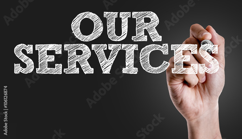 Hand writing the text: Our Services photo