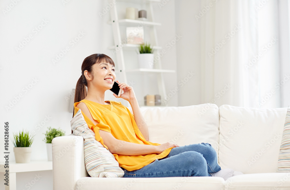 happy asian woman calling on smartphone at home happy asian woman calling on smartphone at home