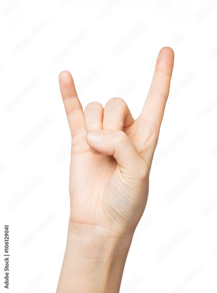 close up of woman hand showing rock sign close up of woman hand showing rock sign