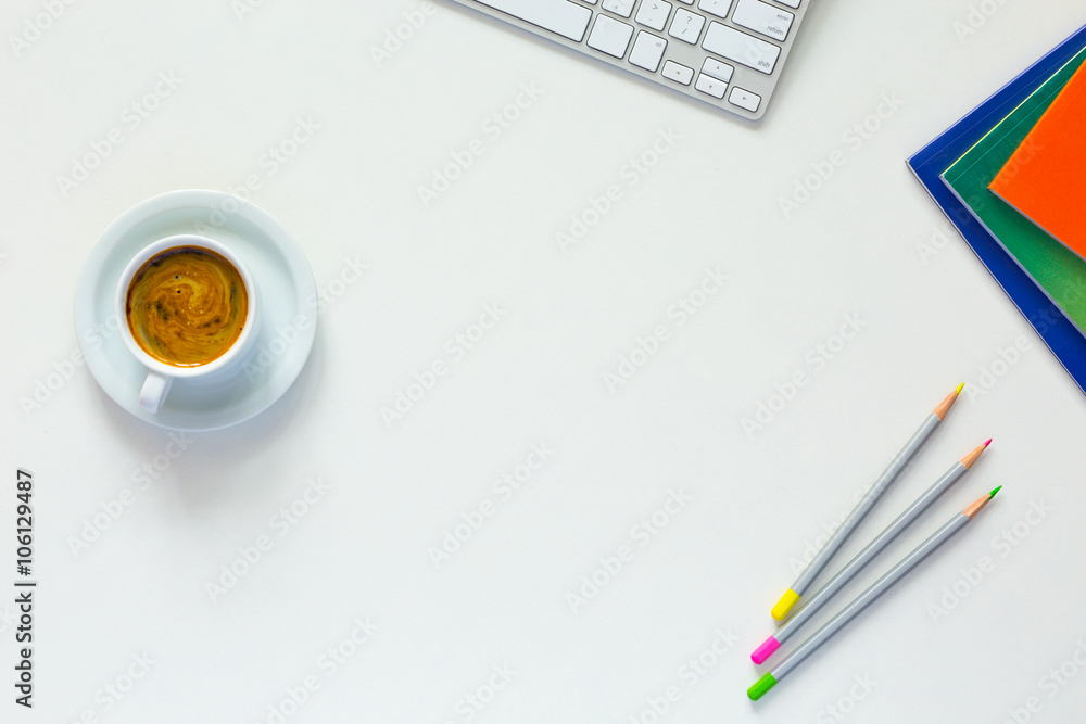 Office White Desk Top View with Business and Every Day Life Items Electronics and Coffee Mug Office White Desk Top View with Business and Every Day Life Items Electronics and Coffee Mug