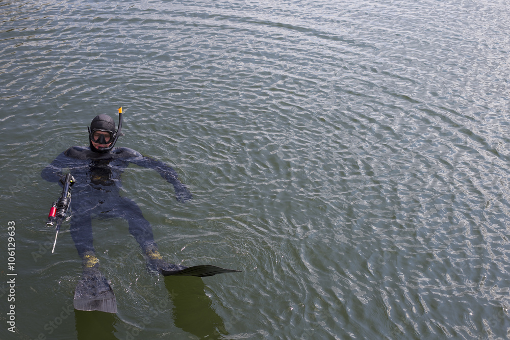Underwater hunter dives into the sea. Underwater hunter dives into the sea.