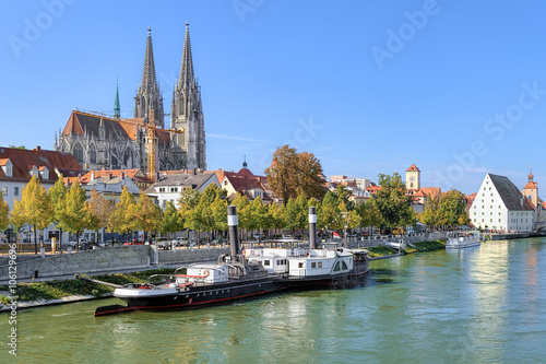 View from Danube on the Regensburg Old Town with Regensburg Cathedral, Old steamship, Tower of Town Hall and Salt House, Germany