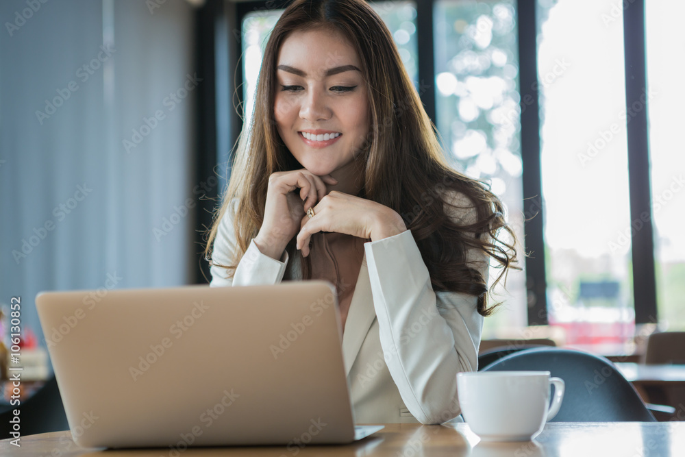 Businesswoman drinking coffee / tea and using tablet computer in Businesswoman drinking coffee / tea and using tablet computer in
