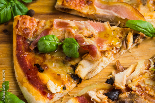 Fresh pizza served on wooden table photo