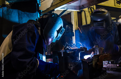 Industrial steel welder in factory