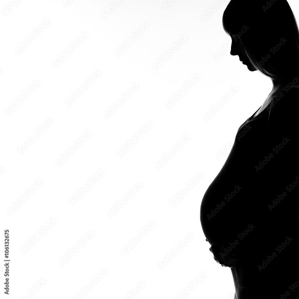 Pregnant woman silhouette with copy space